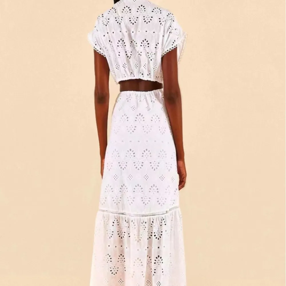 2023 Nuovo stile estivo francese Hollow dimagrante Lace-up vita abito da donna senza maniche gonna a trapezio gonna lunga temper